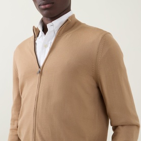 Model wearing Boss Black Casual Balonso Logo Zip Sweater in medium beige, mock neck, fine-knit, styled over white shirt