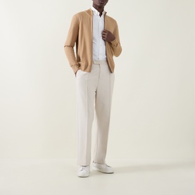 Model wearing Boss Black Casual Balonso Logo Zip Sweater in medium beige, styled with white shirt and cream trousers, white trainers