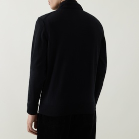 Model wearing Boss Black Casual Balonso Logo Zip Sweater in black, rear view showing mock neck, long sleeves and straight hem