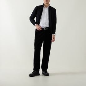 Model wearing Boss Black Casual Balonso Logo Zip Sweater in black with white shirt, black trousers and black loafers.