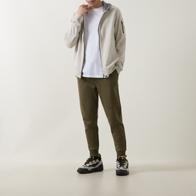 Model wearing Boss Green Label Light Beige casual jacket, styled with white tee, olive joggers and chunky trail trainers.