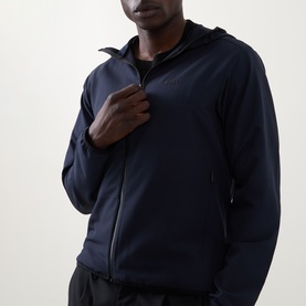 Model wearing Boss Green Label Dark Blue Casual Jacket with hood, zip front, and side pockets, styled with dark trousers