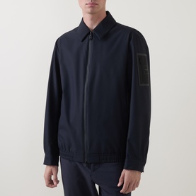Model wearing Boss Green Label Dark Blue Casual Jacket with zip fastening, spread collar, and logo patch on sleeve