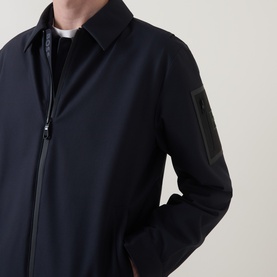 Model wearing Boss Green Label dark blue casual jacket with zip fastening, shirt collar, and sleeve patch detail