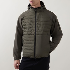 Model wearing Boss Green Label Urbanex Hybrid Quilted Jacket in Open Green, with quilted bodice, hooded collar, and zip fastening