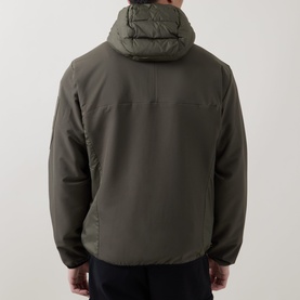 Model wearing Boss Green Label Urbanex Hybrid Quilted Jacket in Open Green, rear view showing hooded collar, quilted bodice and zip pockets.