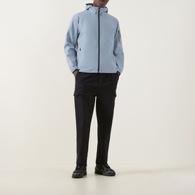 Model wearing Boss Green Label Visit JT Logo Jacket in dark grey with hood, zip fastening, styled with black cargo trousers and dark trainers.