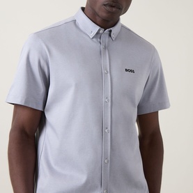 Model wearing Boss Green Label dark grey short-sleeve casual shirt with button-down collar and embroidered logo to chest