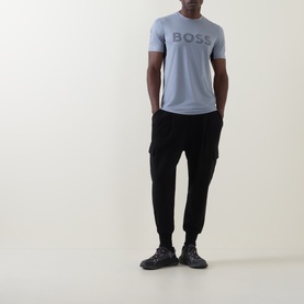 Model wearing Boss Green Label Dark Grey crew neck T-shirt with logo print, styled with black cargo joggers and dark trainers.