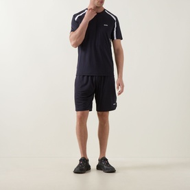 Model wearing Boss Green Label dark blue crew neck T-shirt with white shoulder detail, styled with matching navy shorts and black trainers.