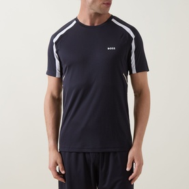Model wearing Boss Green Label dark blue crew neck T-shirt with white contrast raglan stripe detailing on shoulders.