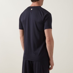 Model wearing Boss Green Label dark blue crew neck T-shirt, back view, styled with matching dark blue shorts.