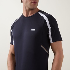Model wearing Boss Green Label dark blue crew neck T-shirt with white raglan sleeves and multicolour side stripe detail