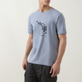 Model wearing Boss Green Label dark grey crew neck T-shirt with geometric graphic print, styled with dark cargo trousers.