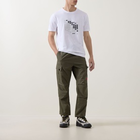 Model wearing Boss Green Label white crew neck T-shirt with graphic print, styled with olive cargo trousers and chunky trainers.
