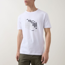 Model wearing Boss Green Label white crew neck T-shirt with abstract graphic print, styled with khaki trousers.