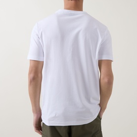 Model wearing Boss Green Label white crew neck T-shirt, back view, styled with olive trousers.