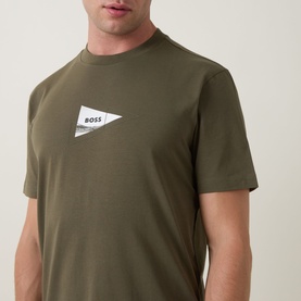 Model wearing Boss Green Label Open Green crew neck T-shirt with small flag logo print on chest