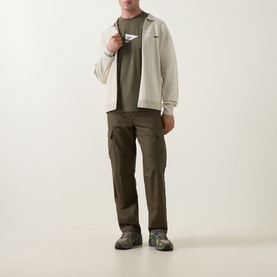 Model wearing Boss Green Label Open Green crew neck T-shirt with ecru zip jacket, khaki cargo trousers and hiking boots.