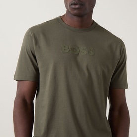 Model wearing Boss Green Label Open Green cotton crew neck T-shirt with tonal embossed logo lettering at chest