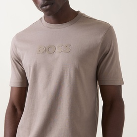 Model wearing Boss Green Label light pastel green cotton crew neck T-shirt with tonal embroidered BOSS logo on chest.
