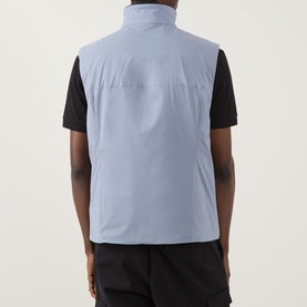 Model wearing Boss Green Label Lite X Logo Gilet in dark grey, back view, styled with black polo shirt and trousers