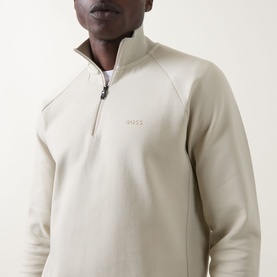 Model wearing Boss Green Label Logo Half-Zip Sweatshirt in light beige with funnel neck and half-zip fastening, logo detail on chest.