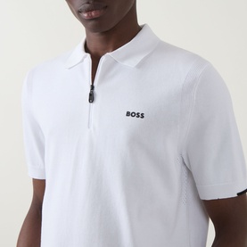 Model wearing Boss Green Label Ever-X Logo Zip Polo Shirt in white with zip collar and contrast logo detail.