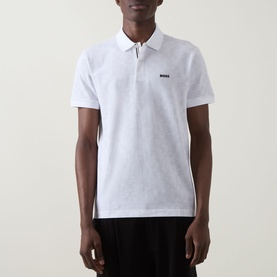Model wearing Boss Green Label Swing Printed Logo Polo Shirt in white with flat-knit collar, two-button placket and short sleeves