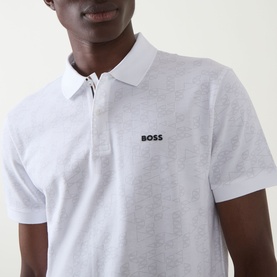 Model wearing Boss Green Label Swing Printed Logo Polo Shirt in white, with flat-knit collar and two-button placket, short sleeves