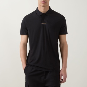 Model wearing Boss Green Label black polo shirt with contrast chest bar detail, short sleeves and collar