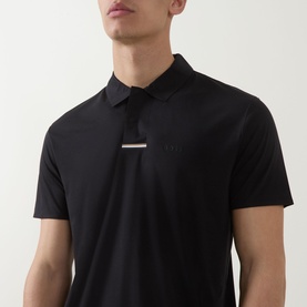 Model wearing Boss Green Label black polo shirt with contrast logo bar detail at chest, short sleeves and collar.