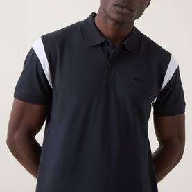 Model wearing Boss Green Label dark blue polo shirt with white shoulder stripe detail and tonal logo, short sleeves