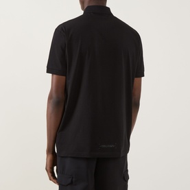 Model wearing Boss Green Label Urban Tech Logo Polo Shirt in black, rear view showing tonal logo detail and straight hem.