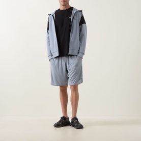 Model wearing Boss Green Label Game Nine Logo Active Shorts in dark grey, styled with matching zip hoodie and black tee and trainers.