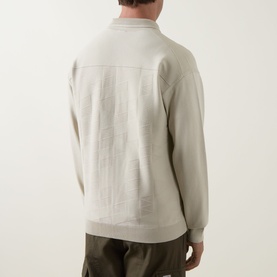 Model wearing Boss Green Label Light Beige zip-through knit, back view, styled with olive trousers