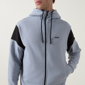 Model wearing Boss Green Label Union Saggy Logo Zip Hoodie in dark grey with black tennis-inspired inserts, drawstring hood and embroidered logo