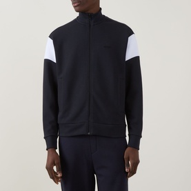 Model wearing Boss Green Label Union Skaz Zip Hoodie in dark blue with white contrast shoulder panels, funnel neck, front zip, and ribbed trims.