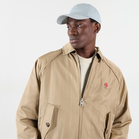Model with Hugo Boss Derrel Logo Patch Baseball Cap in Open Grey, curved visor, six-panel, styled with beige zip-up jacket