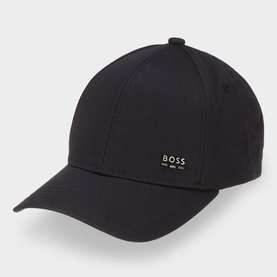 Hugo Boss black cotton baseball cap with structured crown, curved peak and gold-tone metal logo badge on front panel.