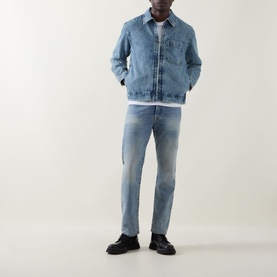 Model wearing Hugo Boss Orange Luney Denim Jacket in turquoise mid wash, styled with light wash jeans and black lace-up shoes