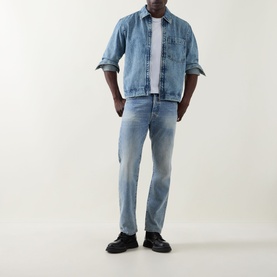 Model wearing Hugo Boss Orange Luney Denim Jacket in turquoise mid wash, styled with matching denim jeans and black shoes