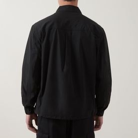 Model wearing Hugo Boss Orange black casual shirt, rear view, relaxed fit with ribbed cuffs and centre back pleat detail