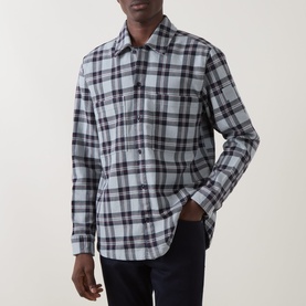 Model wearing Hugo Boss Orange Locky 2 Check Overshirt in Open Grey; long-sleeve cotton check shirt with chest pockets and pointed collar, styled