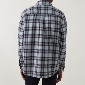 Model wearing Hugo Boss Orange Locky 2 Check Overshirt in Open Grey, rear view, long-sleeved cotton check shirt with box pleat detail.