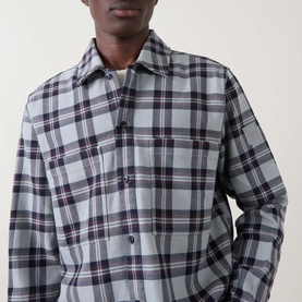 Model wearing Hugo Boss Orange Locky 2 Check Overshirt in Open Grey, featuring check pattern, pointed collar and chest pocket