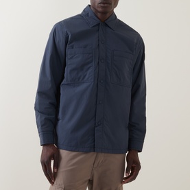 Model wearing Hugo Boss Orange Lody Regular Fit Overshirt in dark blue with chest pockets, pointed collar and concealed button placket, styled with