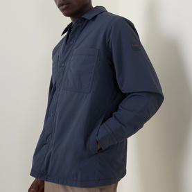 Model wearing Hugo Boss Orange Lody Regular Fit Overshirt in dark blue, showing chest pocket, pointed collar and concealed button placket