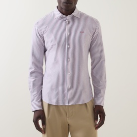 Model wearing Hugo Boss Orange Mysoft Logo Striped Shirt in medium red, long sleeves, chest logo, styled with beige chinos