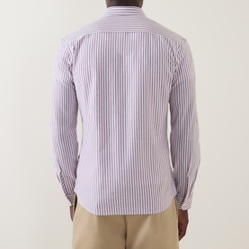 Model wearing Hugo Boss Orange Mysoft Logo Striped Shirt in Medium Red, back view, long sleeves, striped cotton, paired with beige trousers